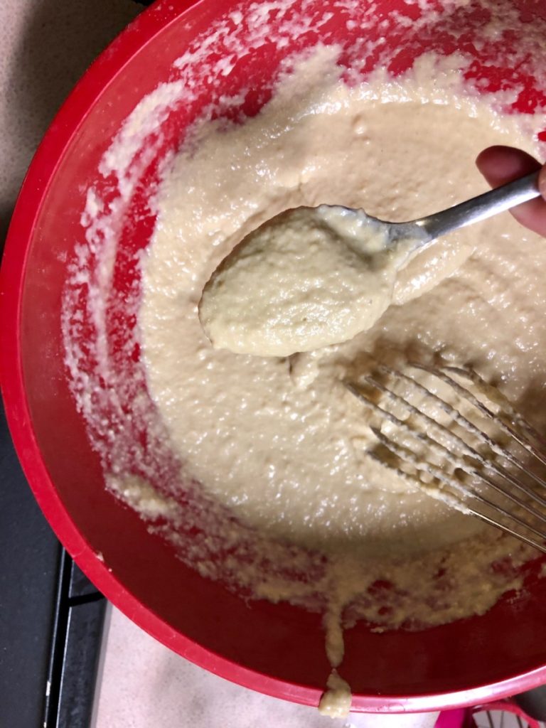 bowl with spoon full of batter